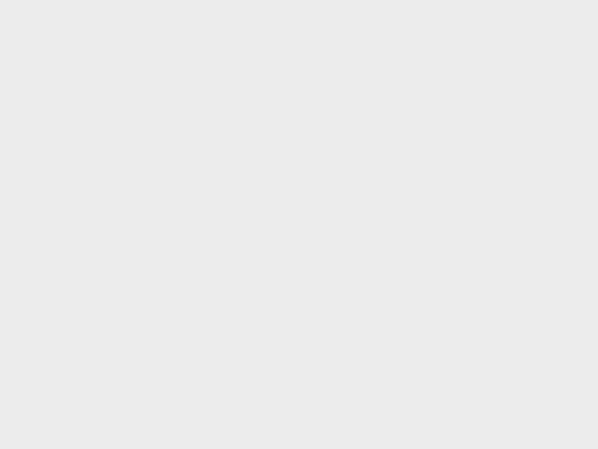 A heavily blurred, censored capture of the Cam4 homepage — only soft shapes are visible, no explicit or readable content