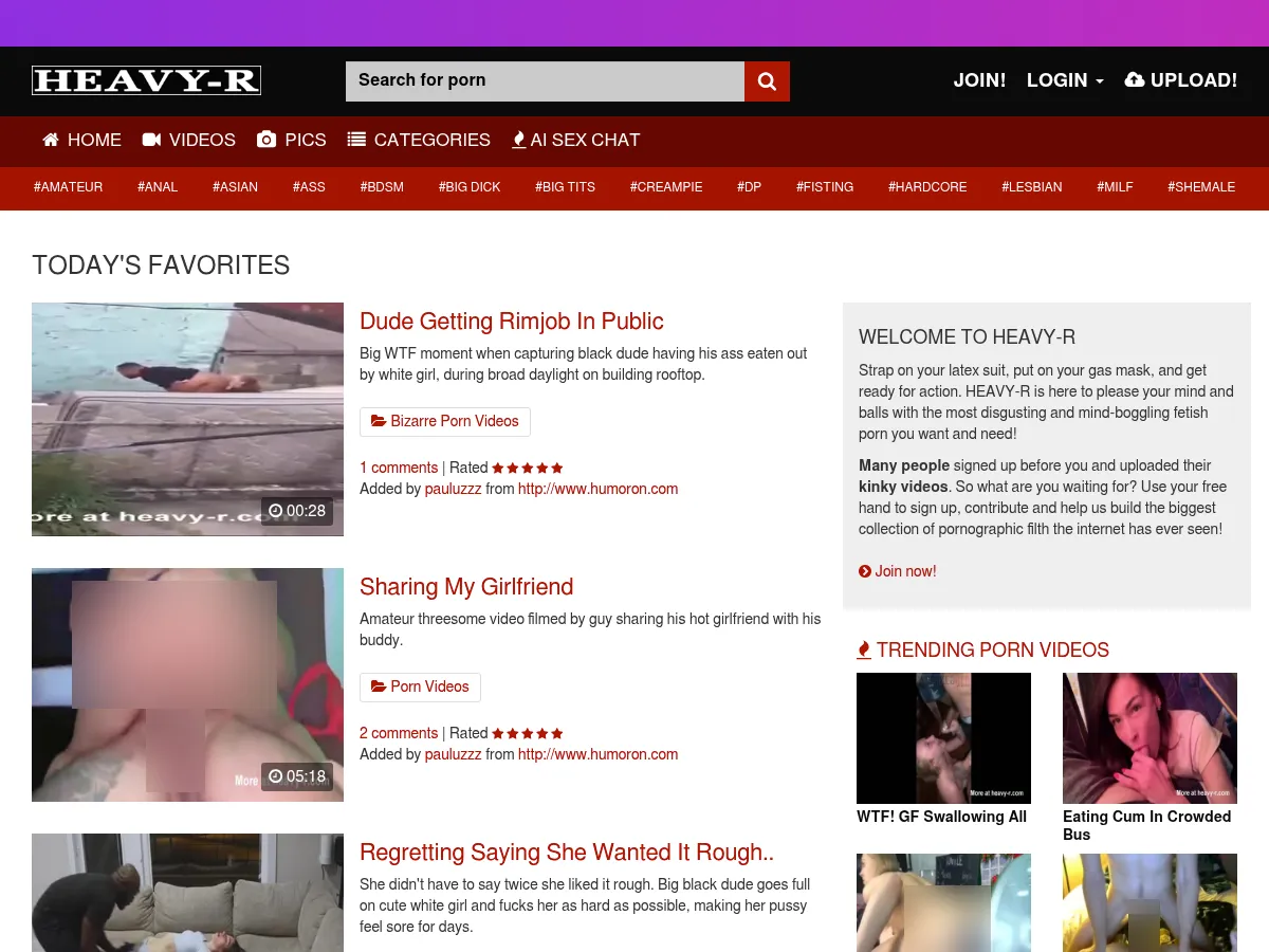 A heavily blurred, censored capture of the Heavy R homepage โ only soft shapes are visible, no explicit or readable content