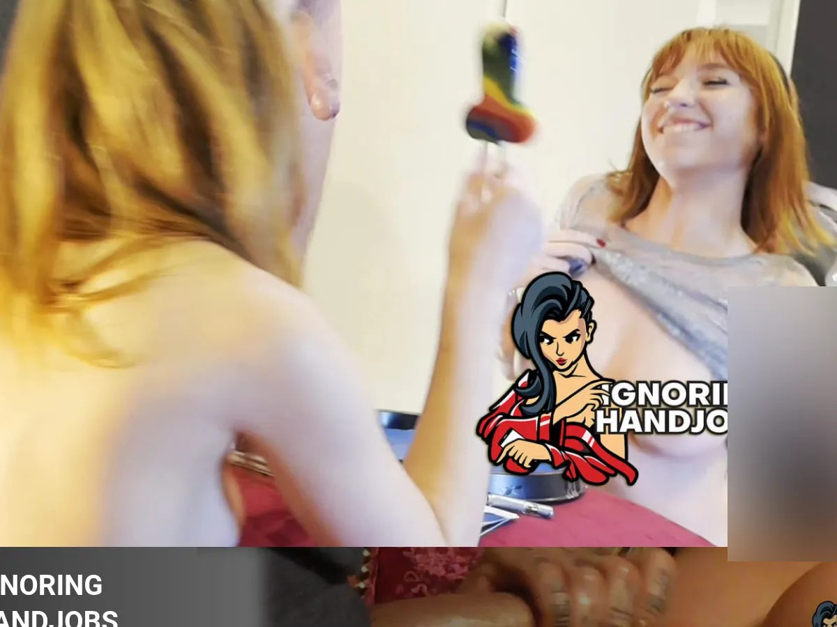 A heavily blurred, censored capture of the Ignoring Handjobs homepage โ only soft shapes are visible, no explicit or readable content