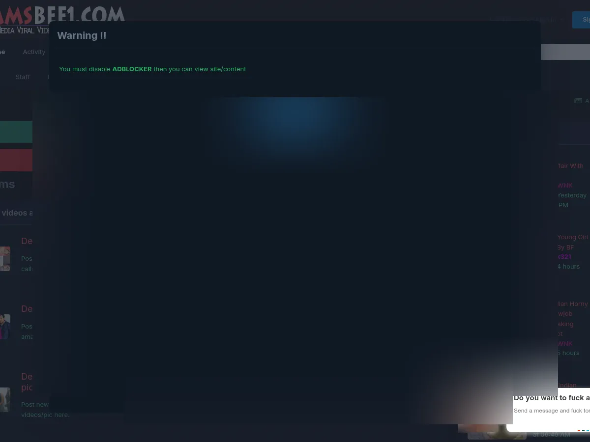 A heavily blurred, censored capture of the MMSBee (MasalaMMS) homepage โ only soft shapes are visible, no explicit or readable content