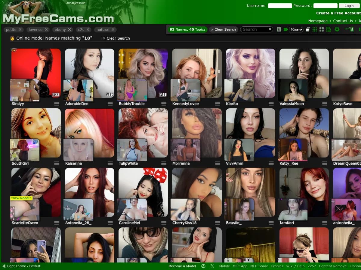 A heavily blurred, censored capture of the MyFreeCams homepage — only soft shapes are visible, no explicit or readable content