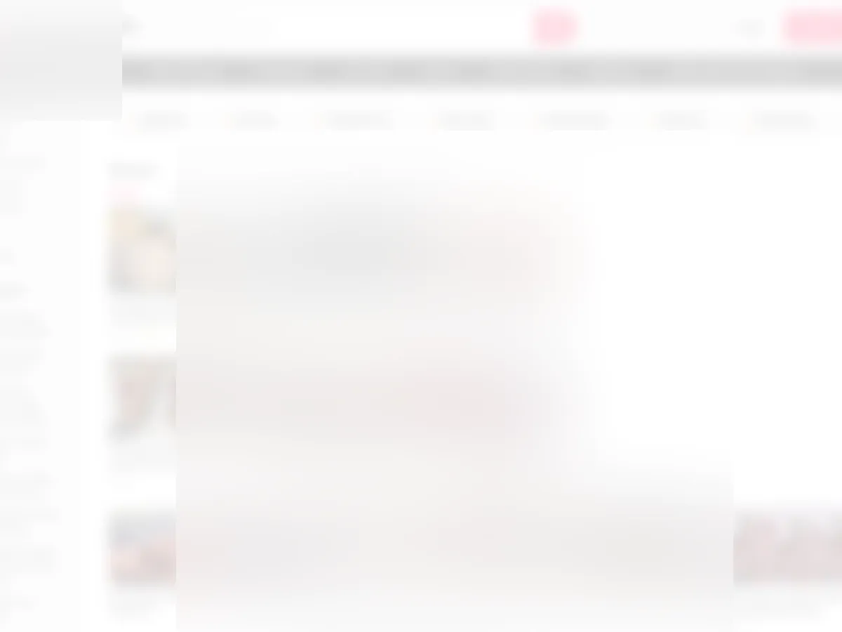 A heavily blurred, censored capture of the NaijaPornSite homepage — only soft shapes are visible, no explicit or readable content