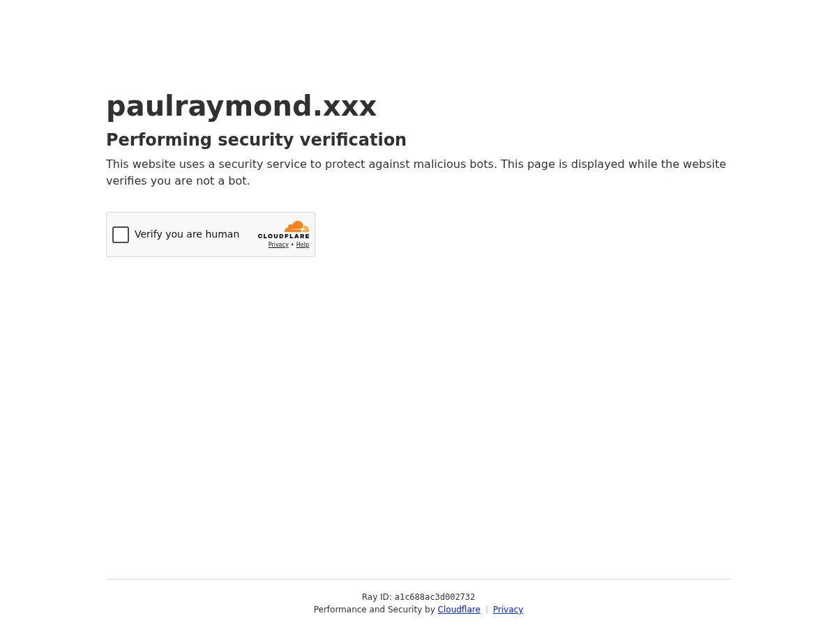 A heavily blurred, censored capture of the Paul Raymond homepage — only soft shapes are visible, no explicit or readable content