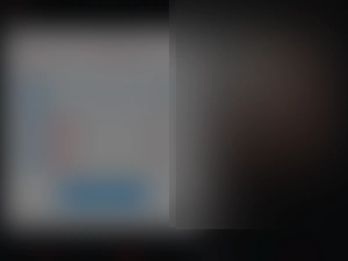 A heavily blurred, censored capture of the R51 homepage — only soft shapes are visible, no explicit or readable content
