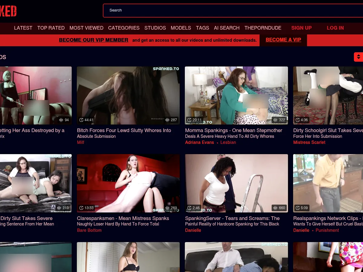 A heavily blurred, censored capture of the Spanked.to homepage โ only soft shapes are visible, no explicit or readable content