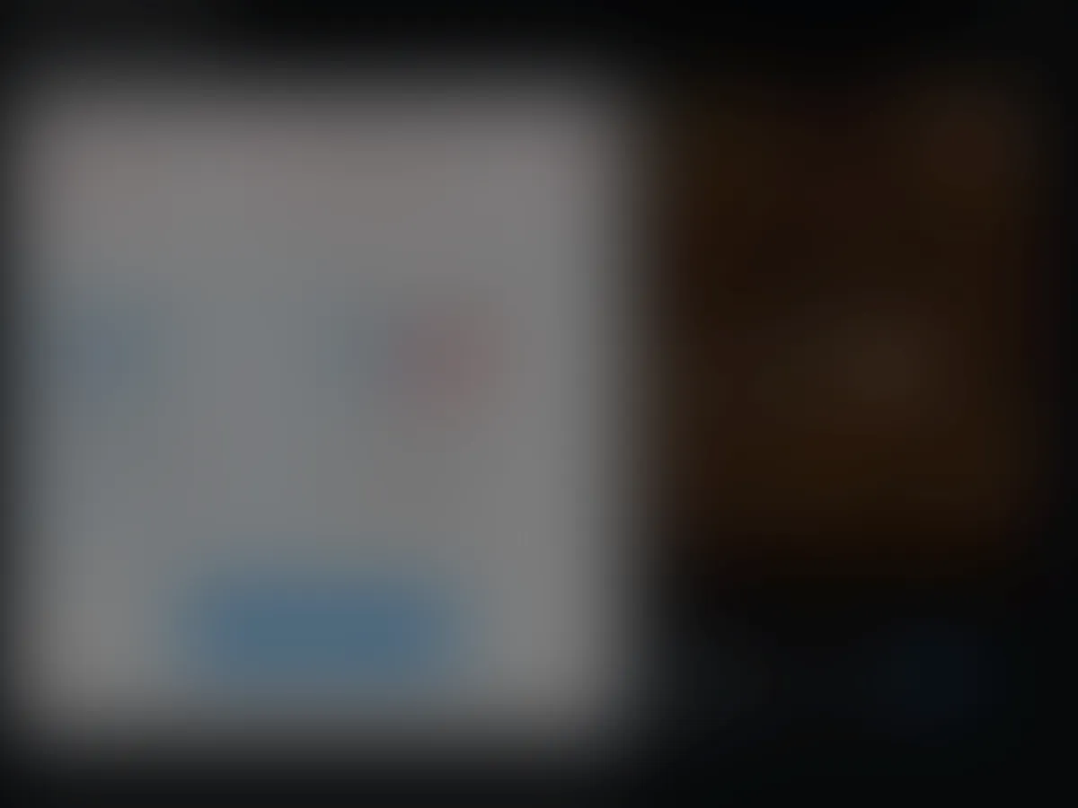 A heavily blurred, censored capture of the Unreal Porn homepage โ only soft shapes are visible, no explicit or readable content