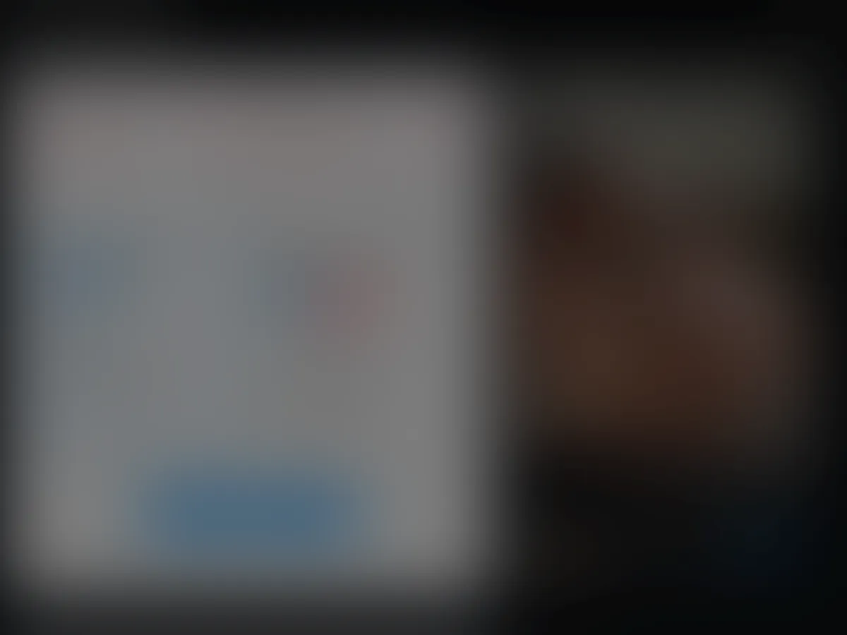 A heavily blurred, censored capture of the Unusual People homepage โ only soft shapes are visible, no explicit or readable content