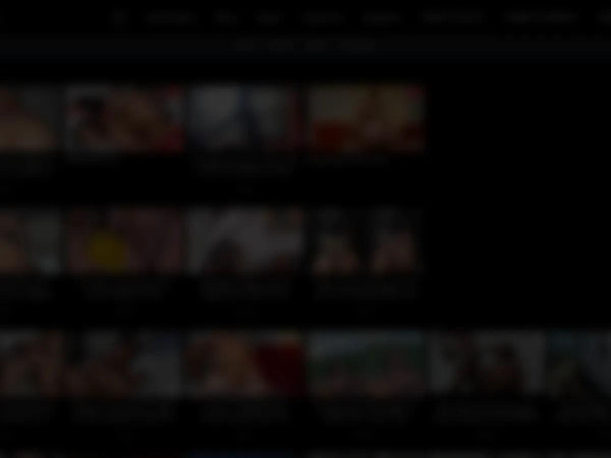 A heavily blurred, censored capture of the XXXWISE homepage — only soft shapes are visible, no explicit or readable content